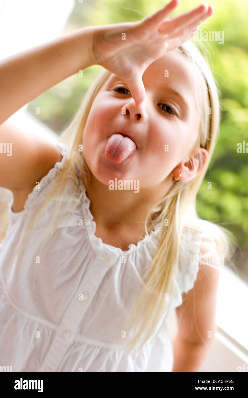 girl sticking her tongue out Stock Photo
