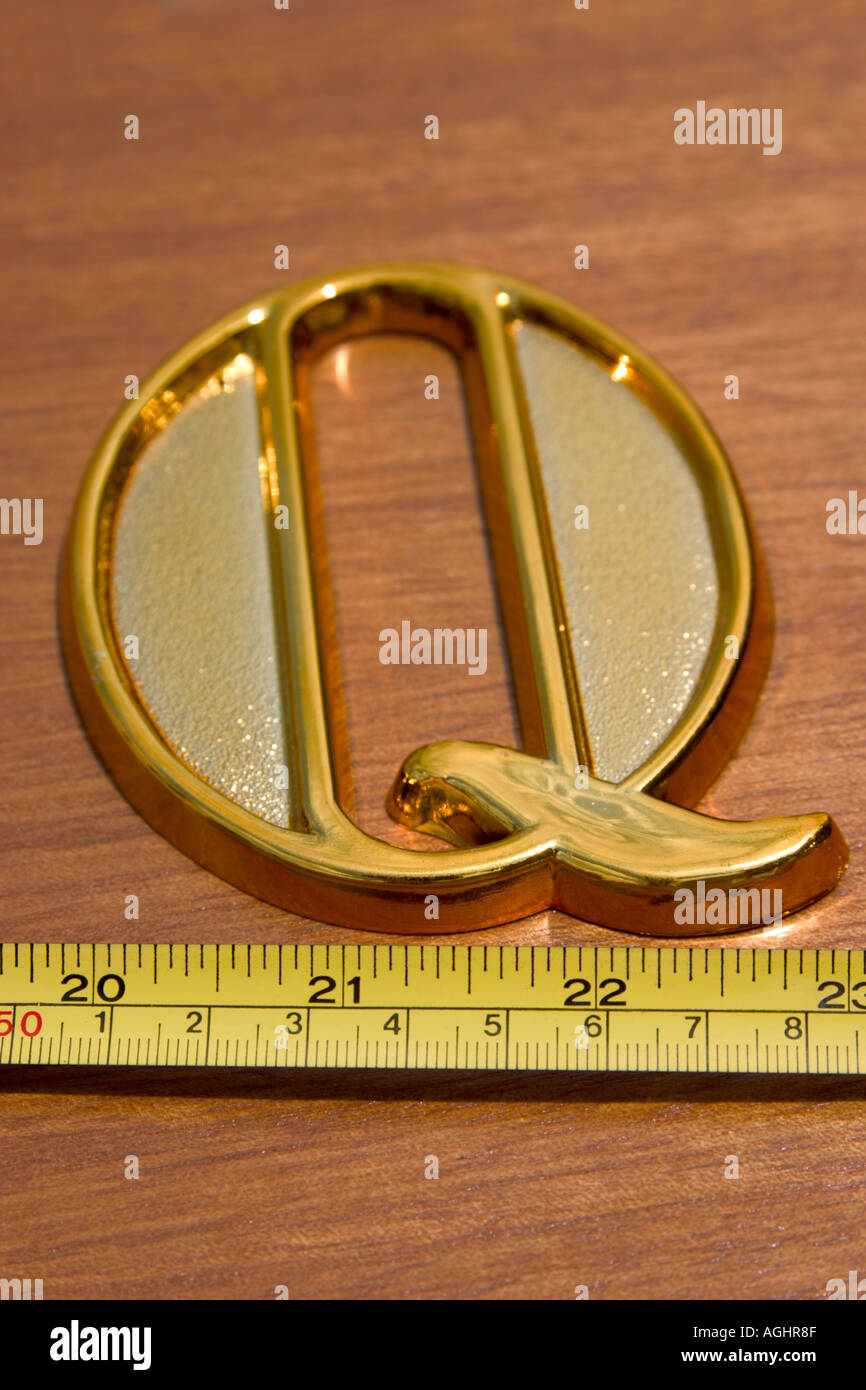letter Q and measure tape concept of measuring quality Stock Photo