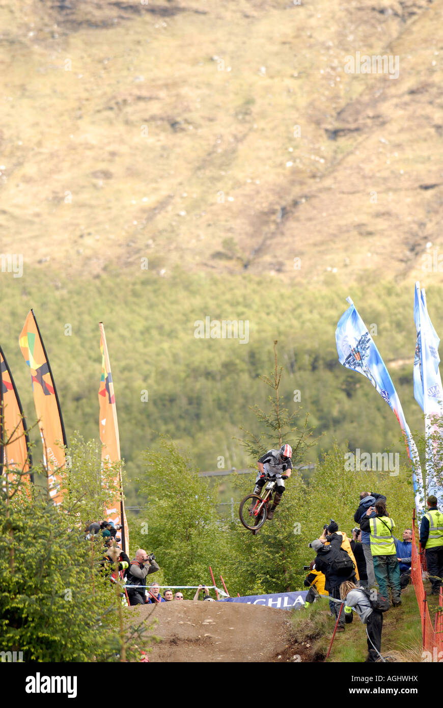 A downhill mountain bike racer wows the crowd at the Fort William World