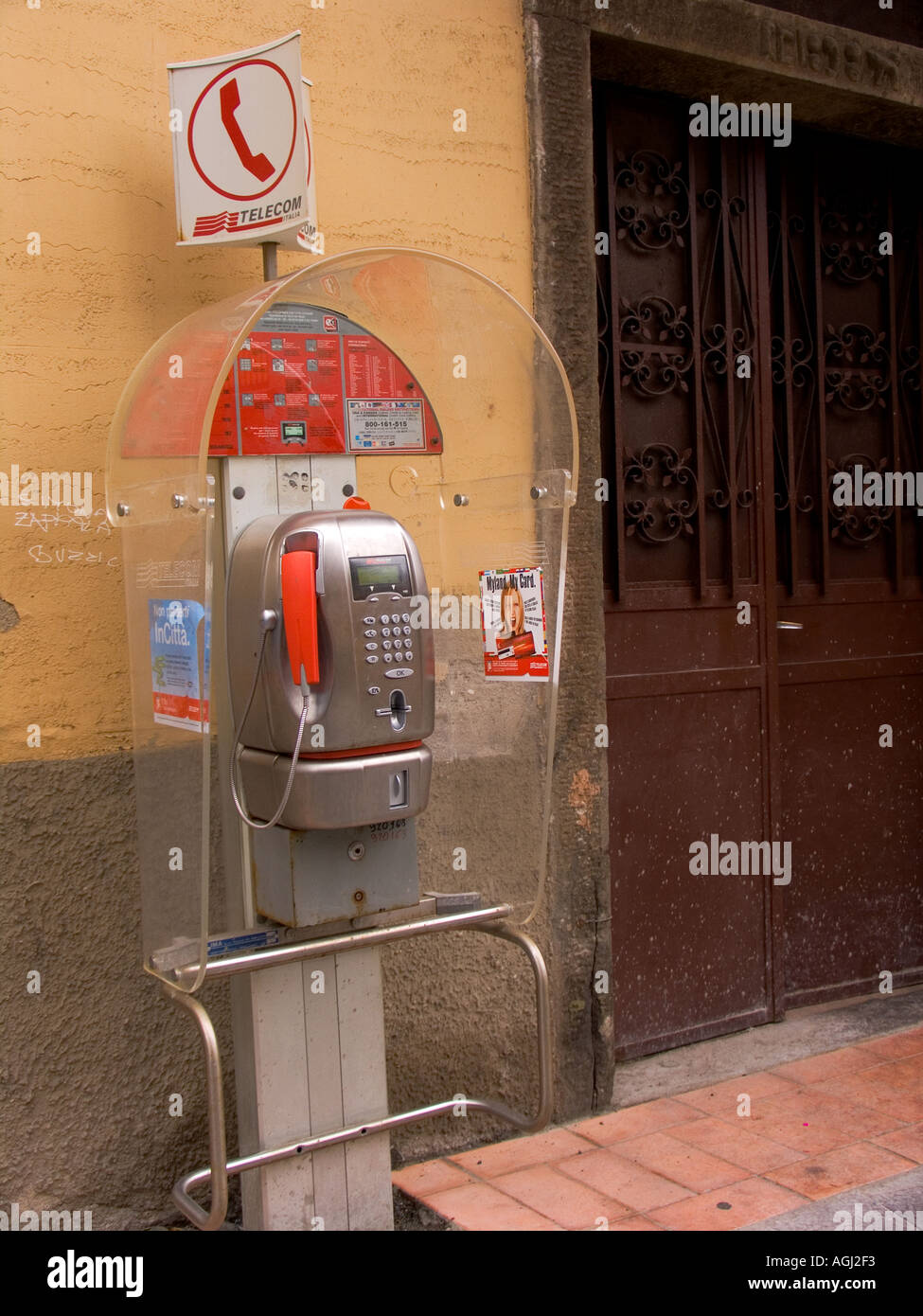 Telephone booth on street in Manarola Italy Stock Photo