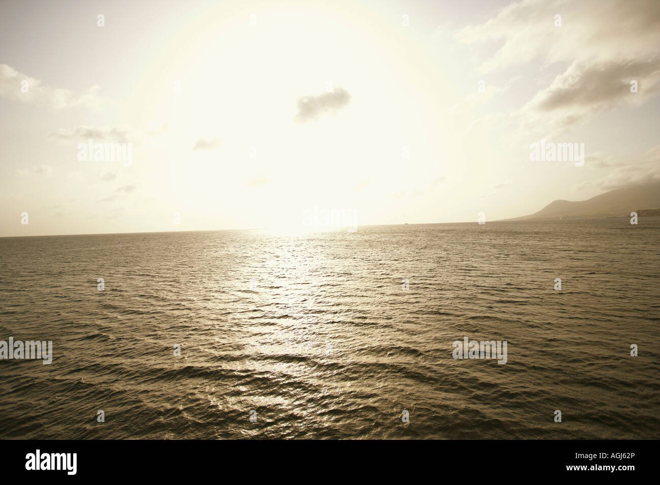 Sun shining over the sea Stock Photo - Alamy