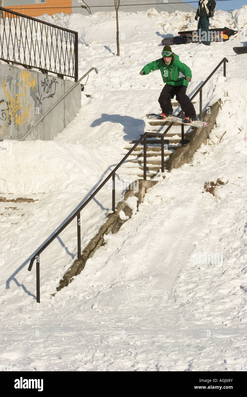 Jibbing snowboard in the city 4 Stock Photo Alamy