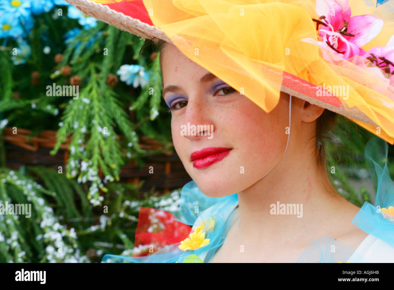 Woman wearing a colourful hat, Madeira Funchal Spring Flower Festival Stock Photo