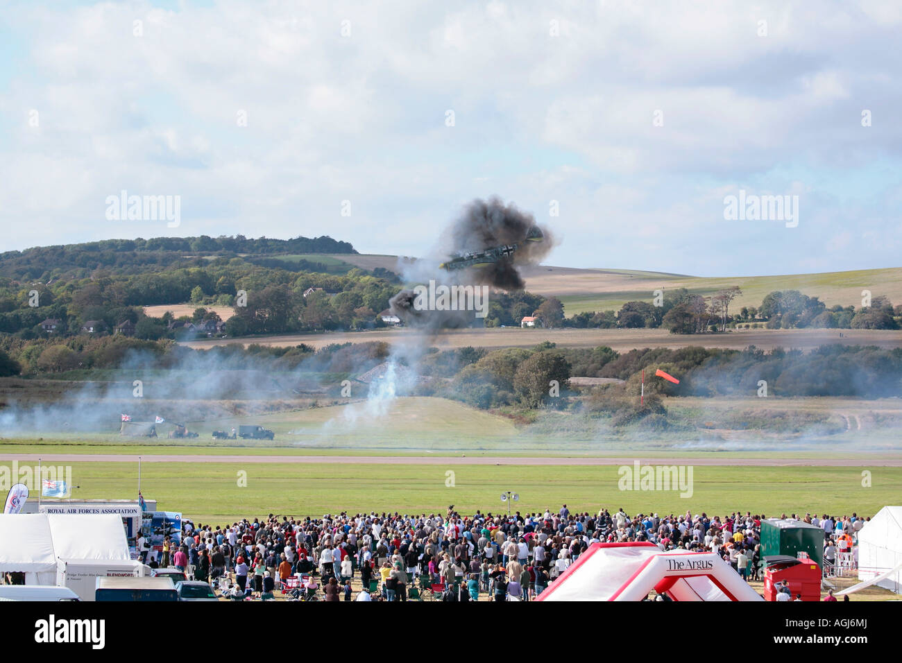 Spectators watching pyrotechnic display at UK airshow. Shoreham airshow, Shoreham Airport, West Sussex, England Stock Photo