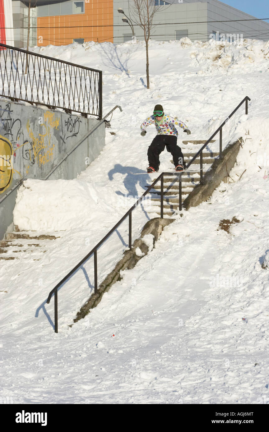 Jibbing snowboard in the city 2 Stock Photo Alamy