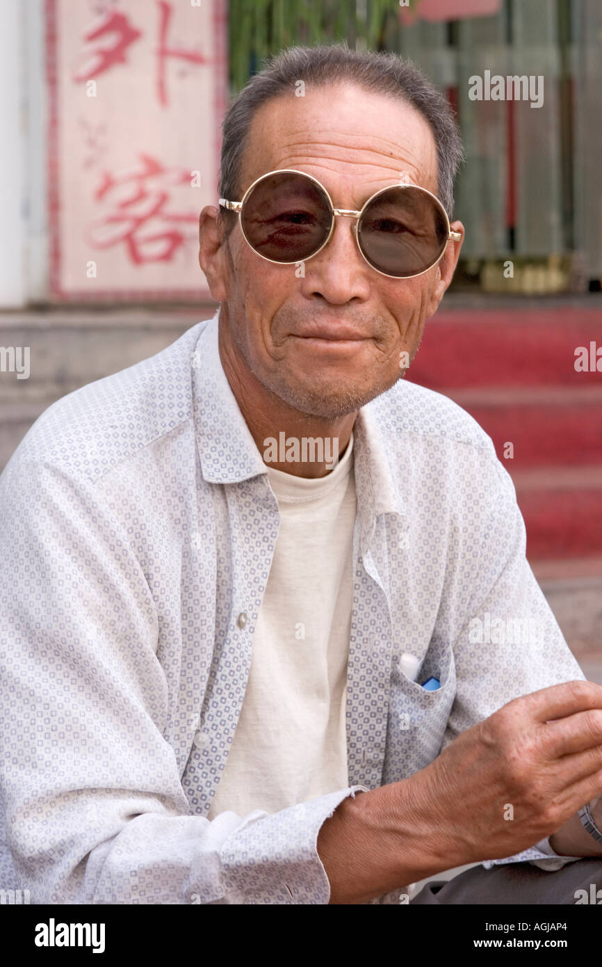 asia china chinese with sunglasses on market in dunhuang Stock Photo