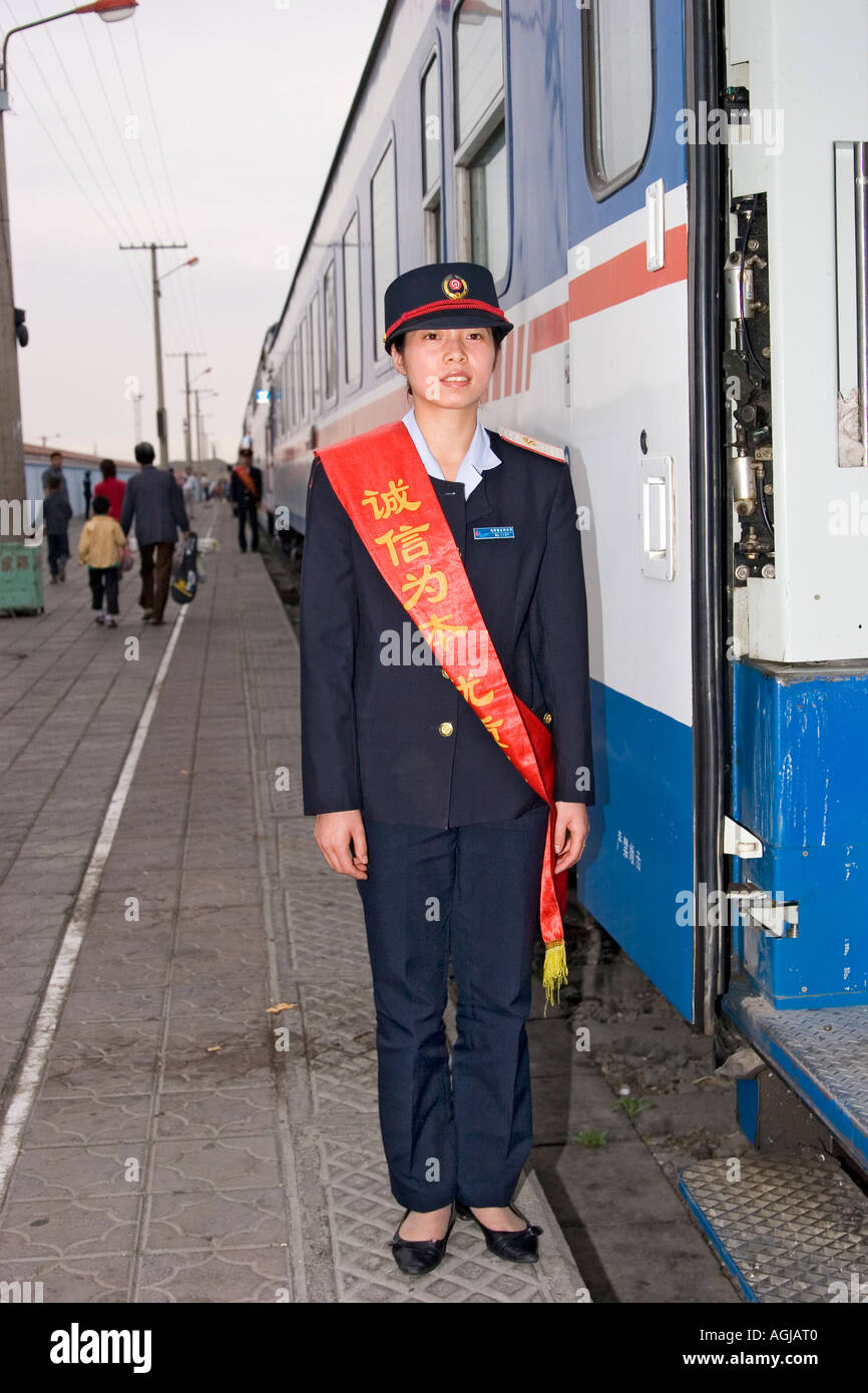 asia china chinese officer in front of train on platform in liuyuan Stock Photo