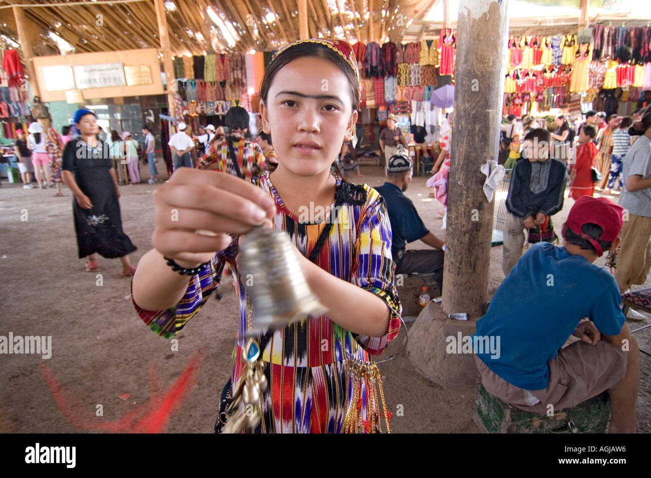 asia china turfan turpan ruincity jaohe joung uygur woman offers gifts Stock Photo
