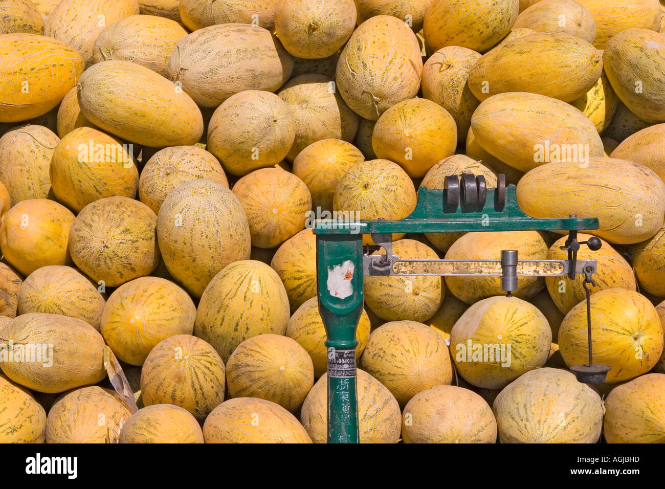 asia china large number of melons with balance on a market in yutian at silkroad Stock Photo