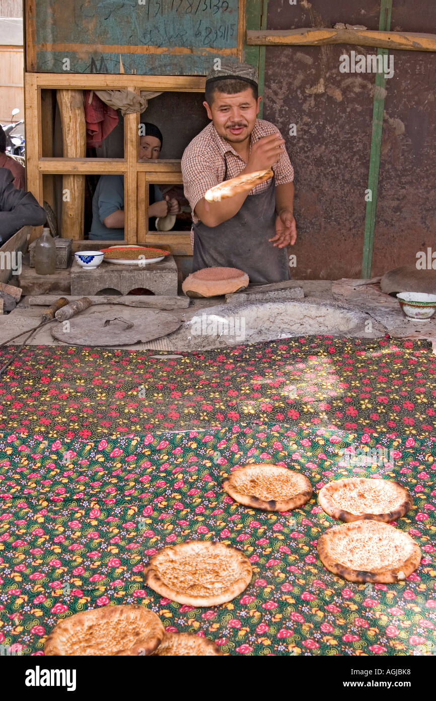 asia china baker with bread on market in yutian at silkroad Stock Photo