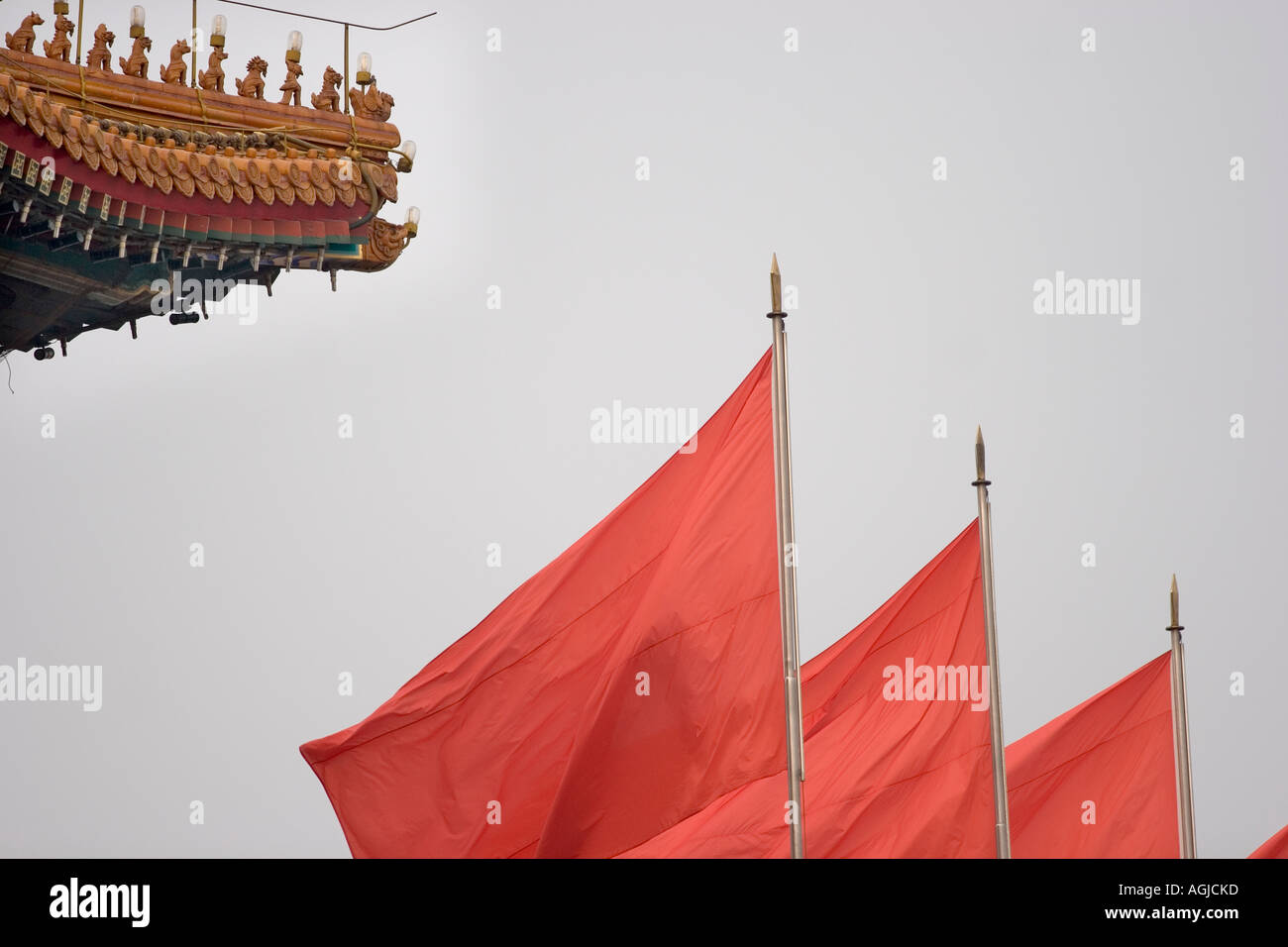 asia china roofs with mythical creatures and red flags in forbidden city in beijing Stock Photo