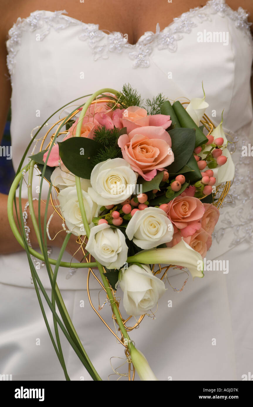 bouquet of flowers pink and white roses held by bride at her wedding ...