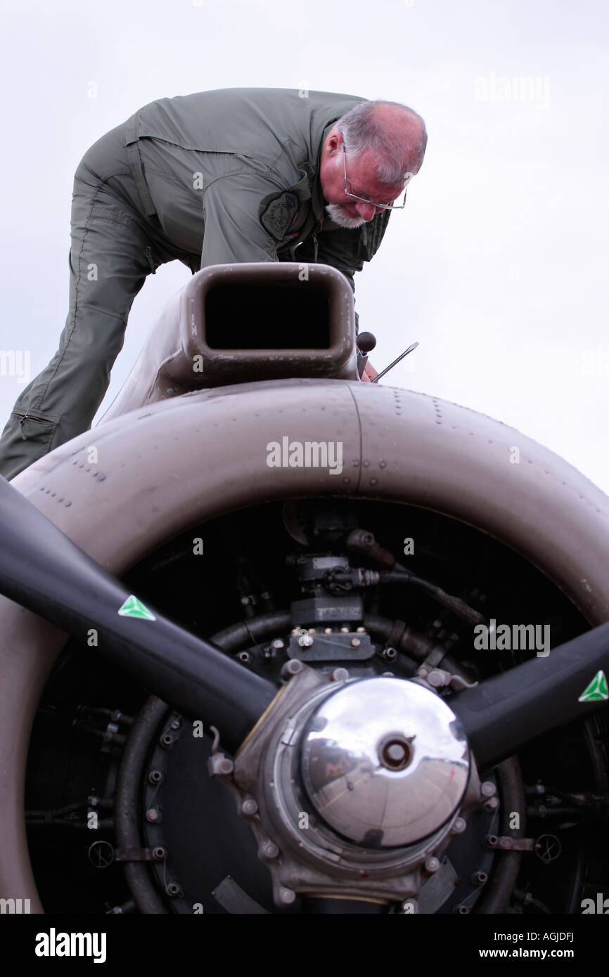 Engineer from the Duke of Brabant Air Force working on the B-25 Mitchell 'Sarinah' at Shoreham Airport, West Sussex, England, UK Stock Photo