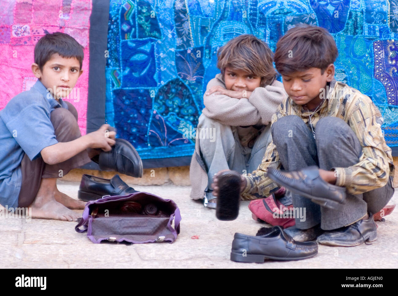 india shoeshine boys in the desert city jaisalmer in rajasthan Stock Photo
