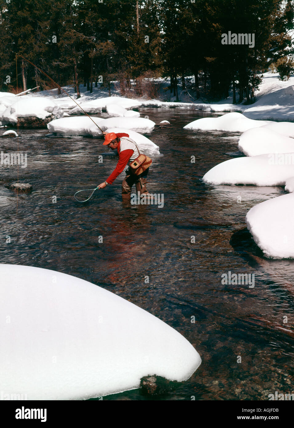 Winter fishing in Redfish Creek in the Sawtooth National Recreation Area of Idaho Stock Photo