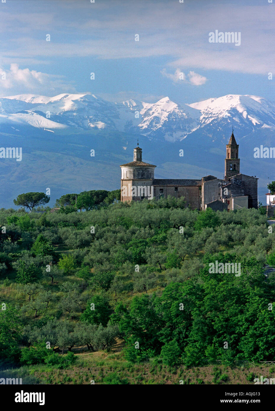 The Appenine Mountains of the Gran Sasso overlook a church at Loreto Aprutino in the Abbruzzo region of Italy Stock Photo