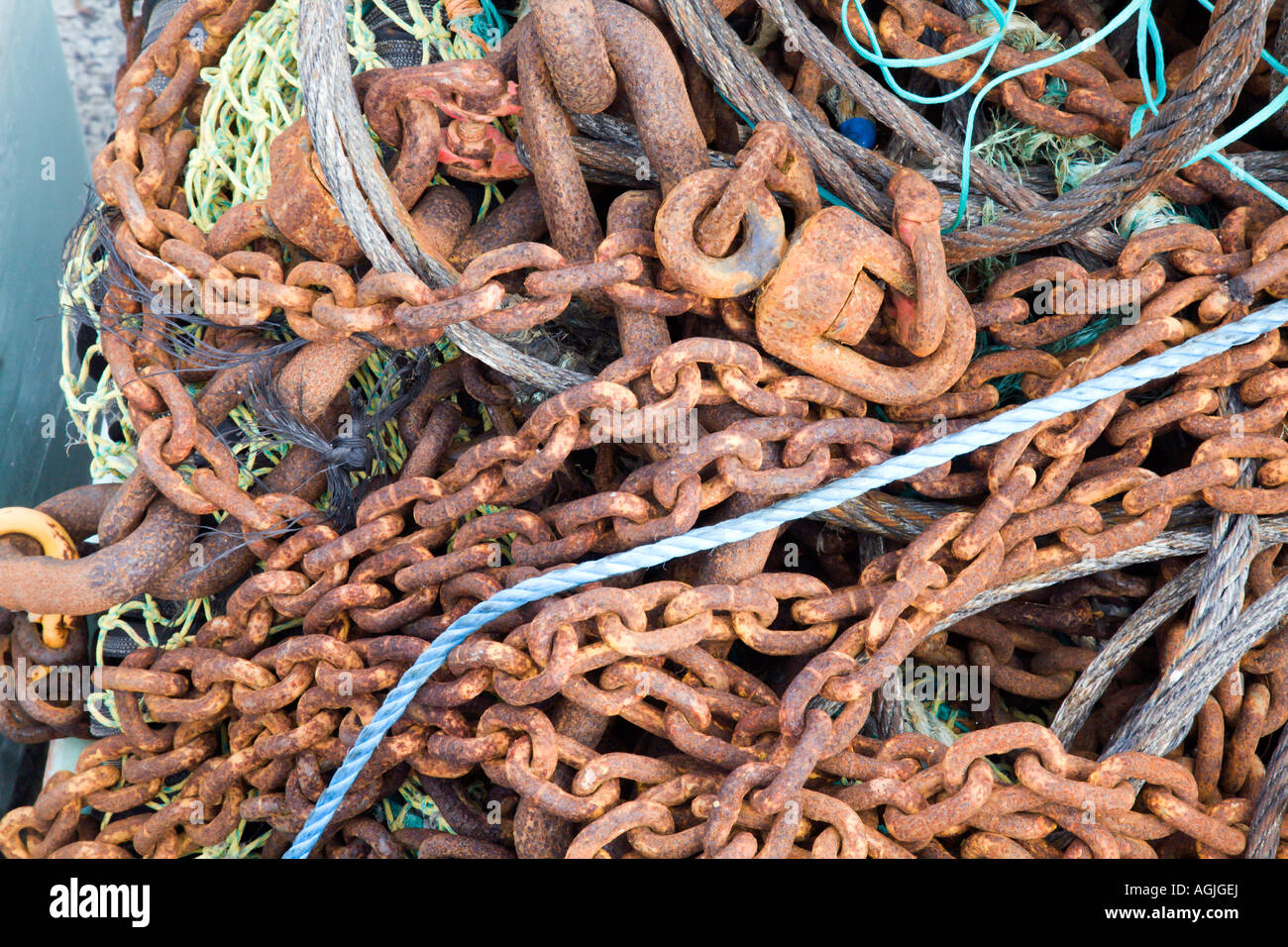 Fishing equipment piled up on the harbour wall at Newlyn in Cornwall Stock Photo