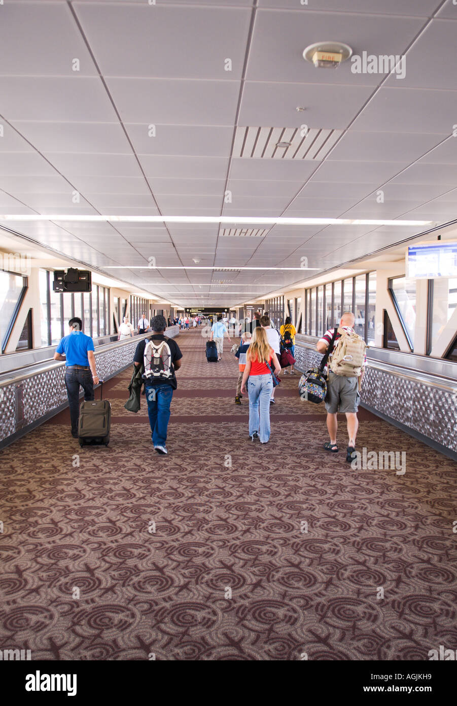 Passengers take the long walk between terminals at the Phoenix Airport