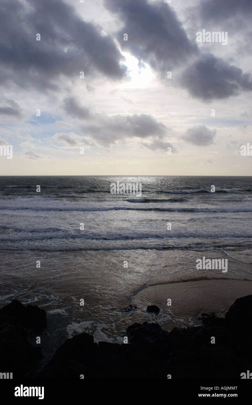 View out to sea on a stormy day with dramatic lighting and clouds Stock Photo