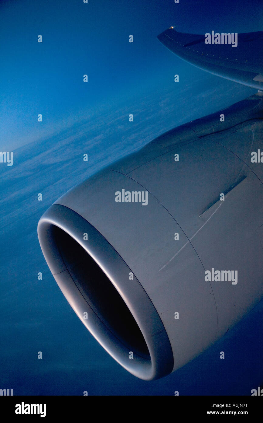graphic shot of airplane wing and engine taken at sunrise Stock Photo
