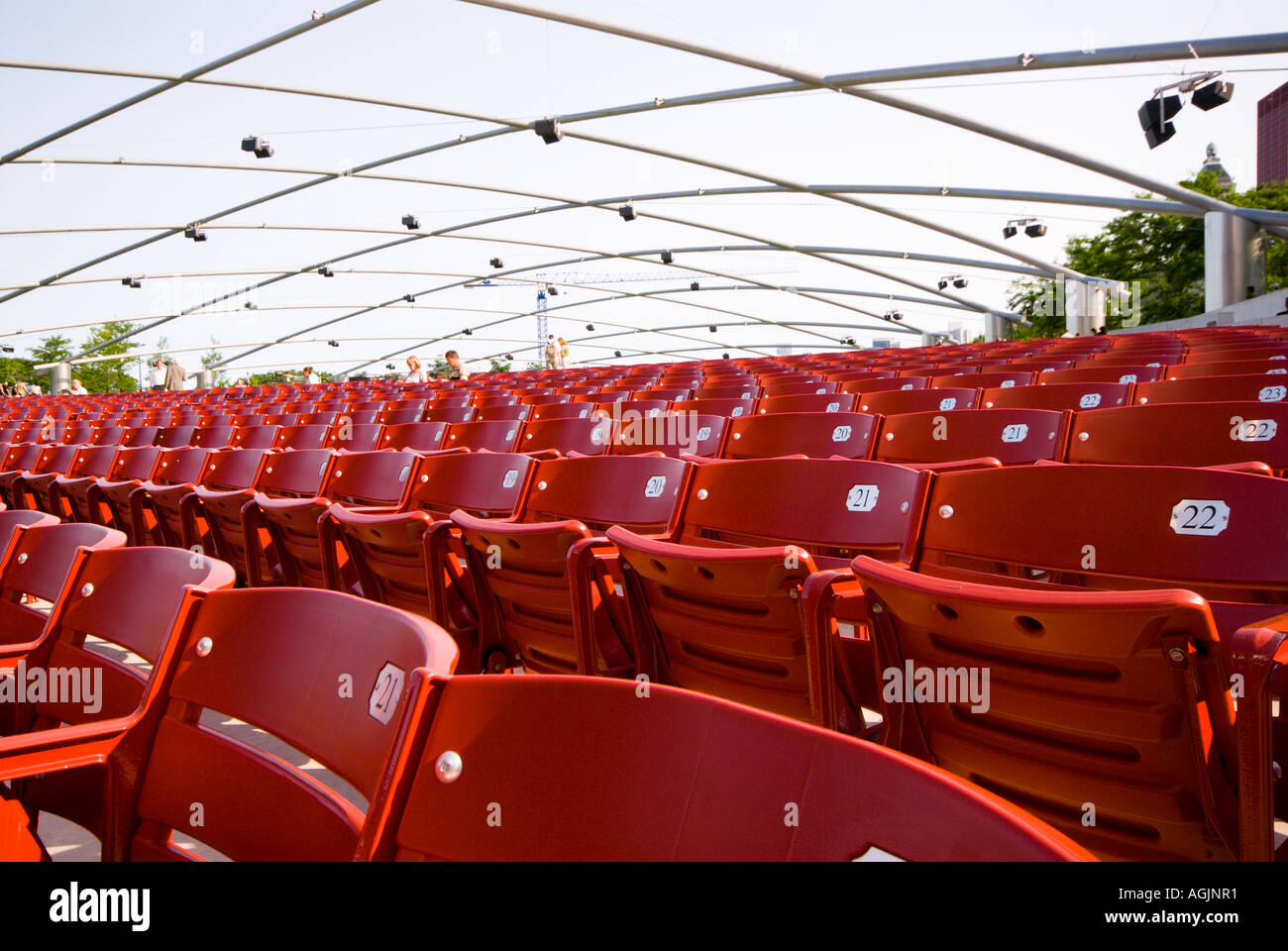 Red chairs at the Jay Pritzker Pavilion in Millenium Park in downtown Chicago Illinois Stock Photo