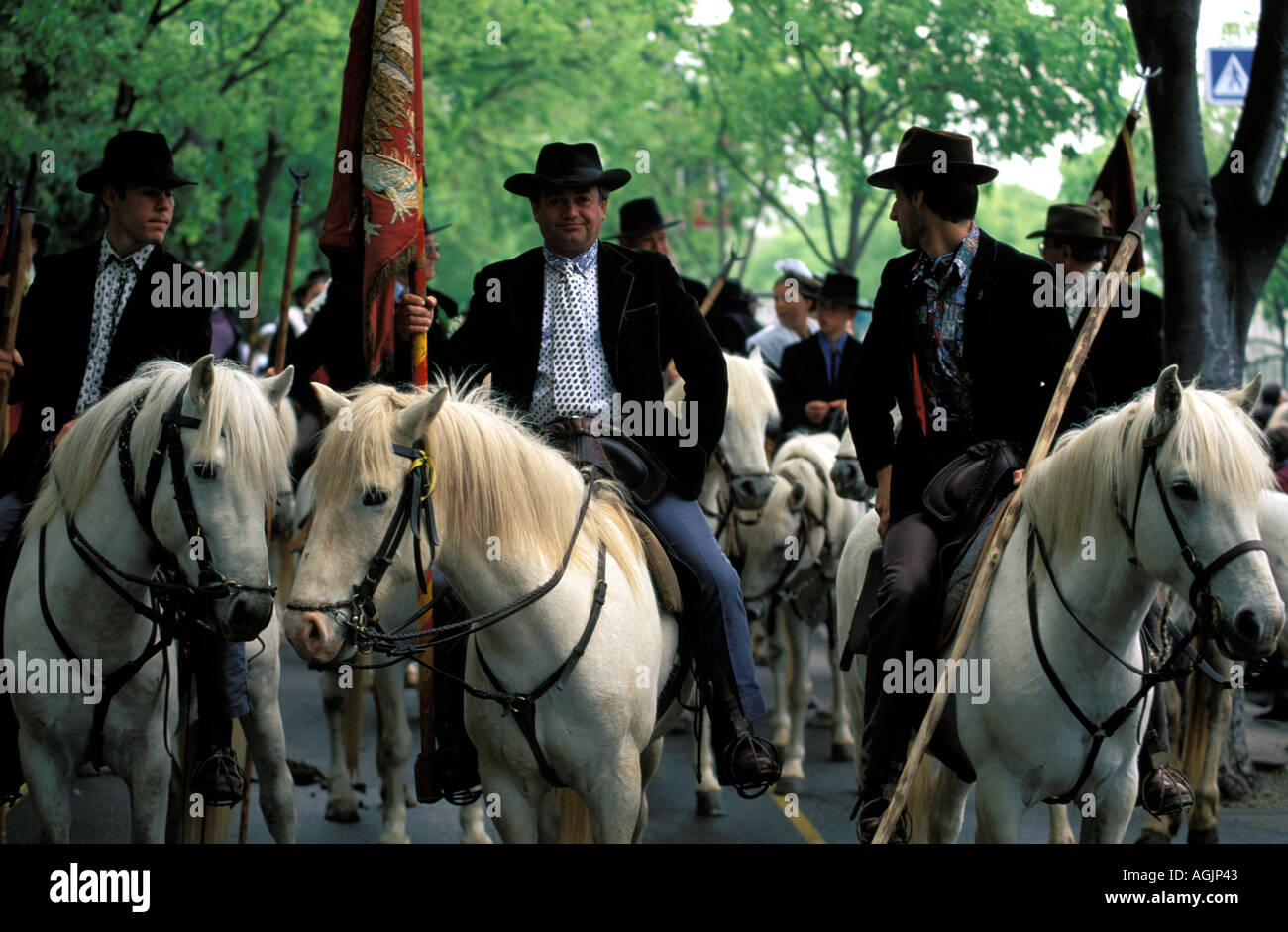 Arles gardians on horseback parading at the Fete des Gardians festival Stock Photo