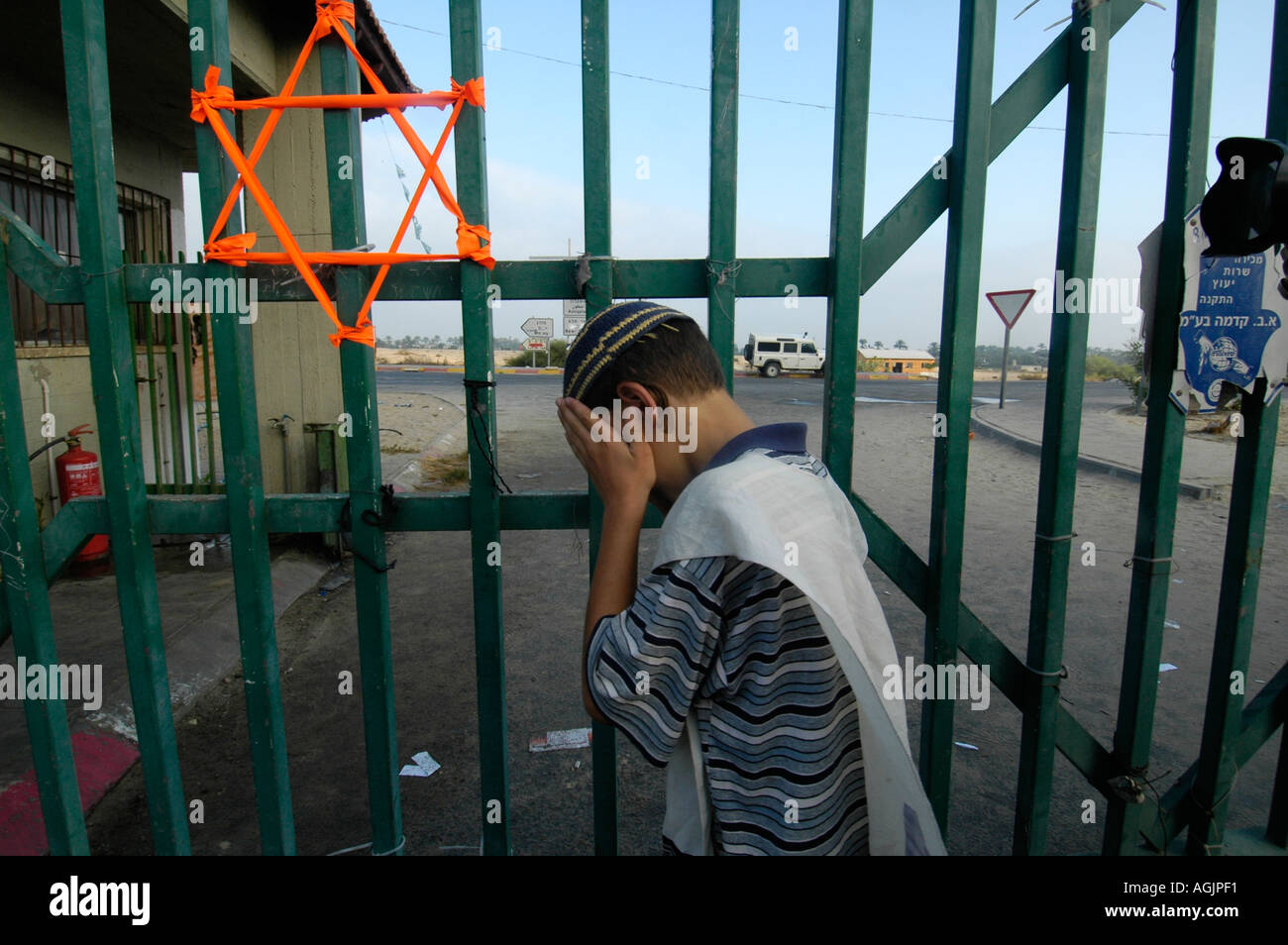 Orange ribbons tied into the gate of Neveh Dekalim symbolizing the struggle against the eviction from Jewish settlements in Gush Katif Gaza strip Stock Photo
