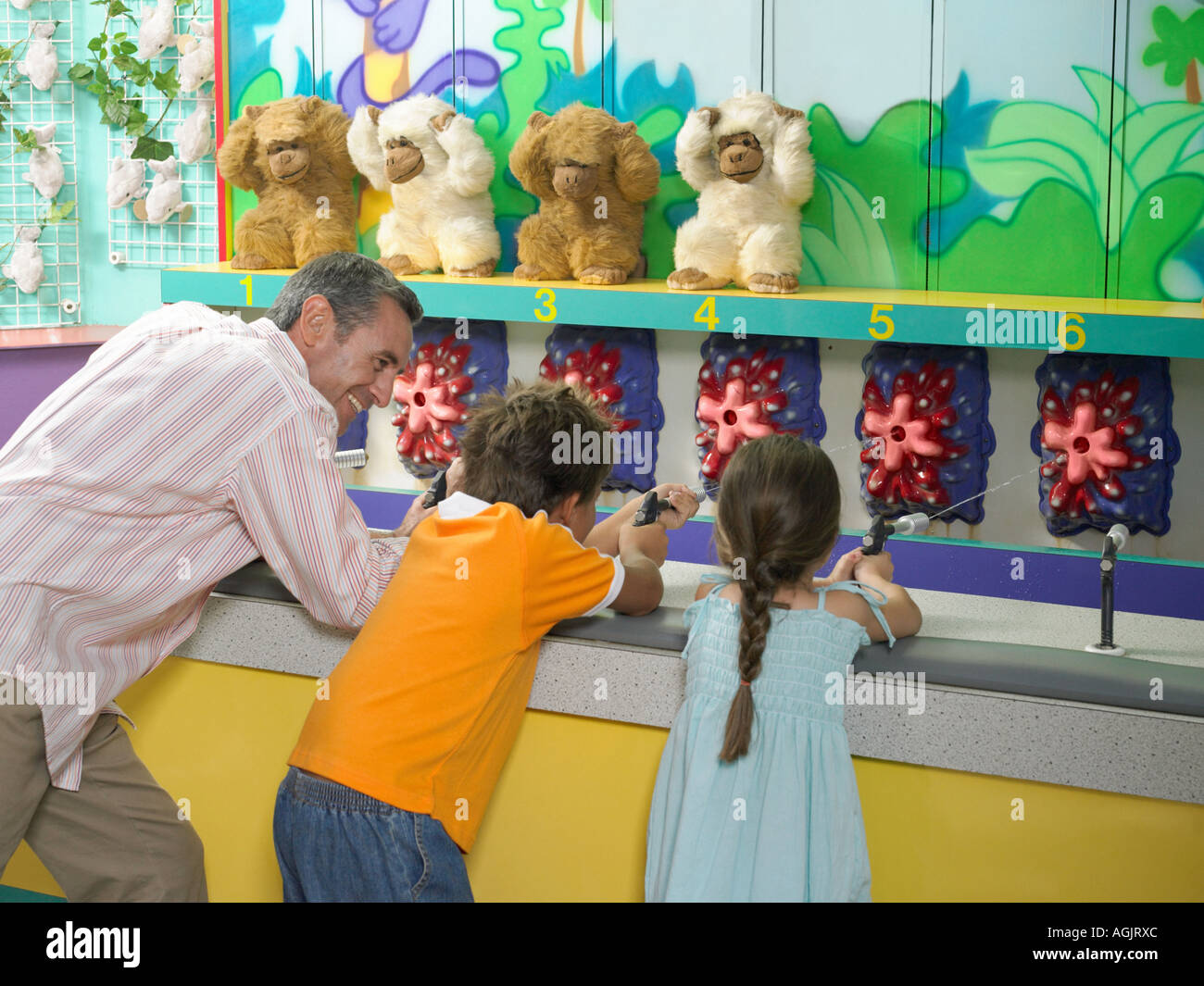Father and kids on fairground stall Stock Photo