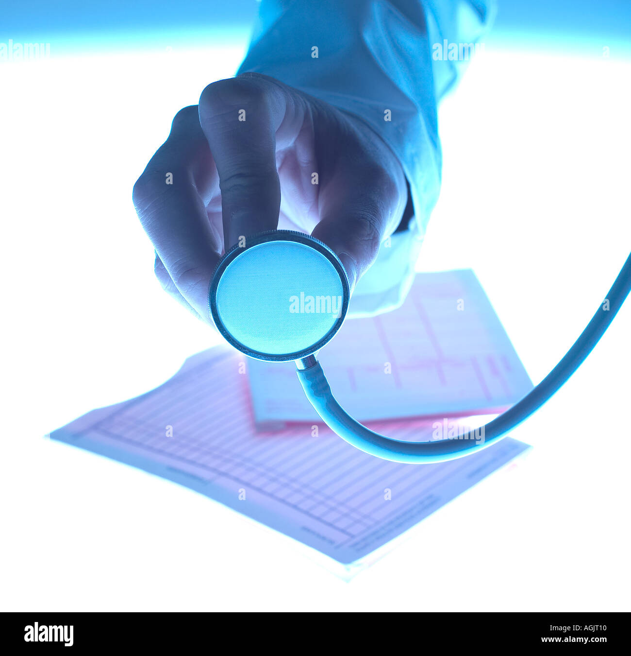 Doctor using stethoscope Stock Photo - Alamy