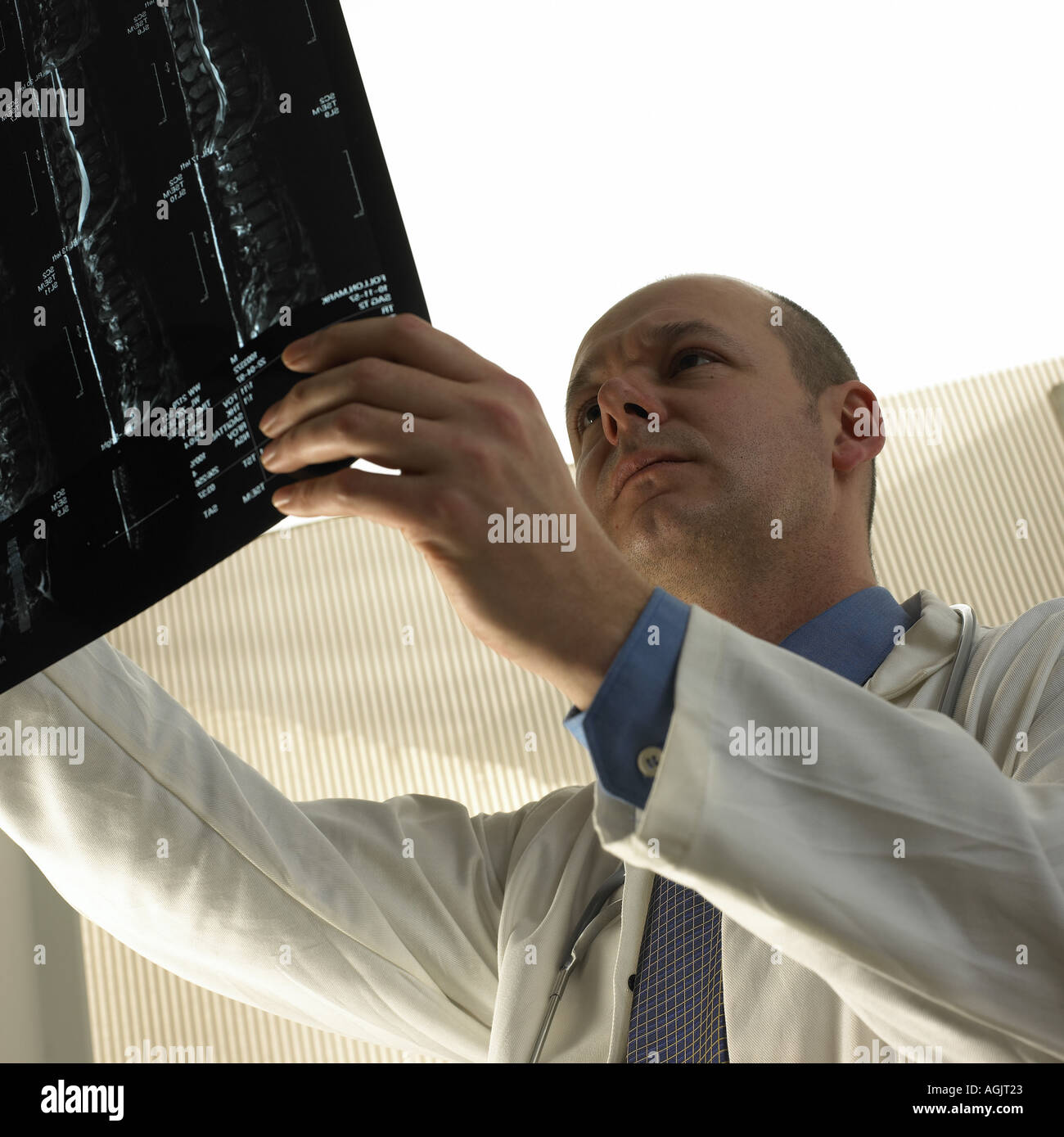Doctor looking at x ray picture Stock Photo
