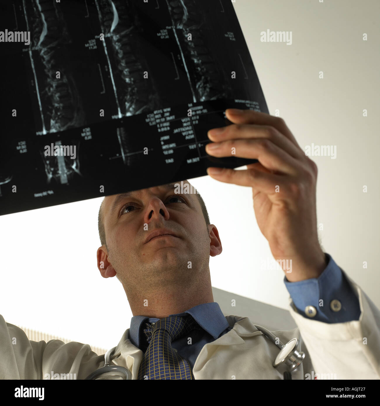 Doctor looking at x ray picture Stock Photo - Alamy