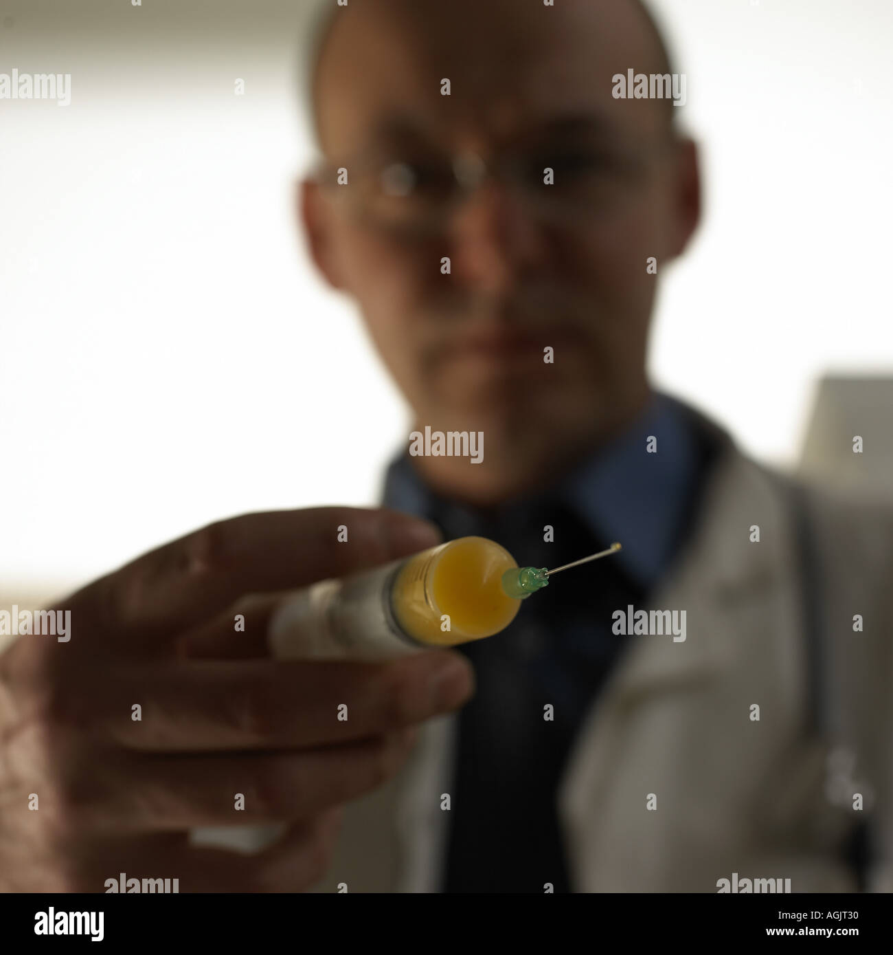 Doctor using syringe Stock Photo
