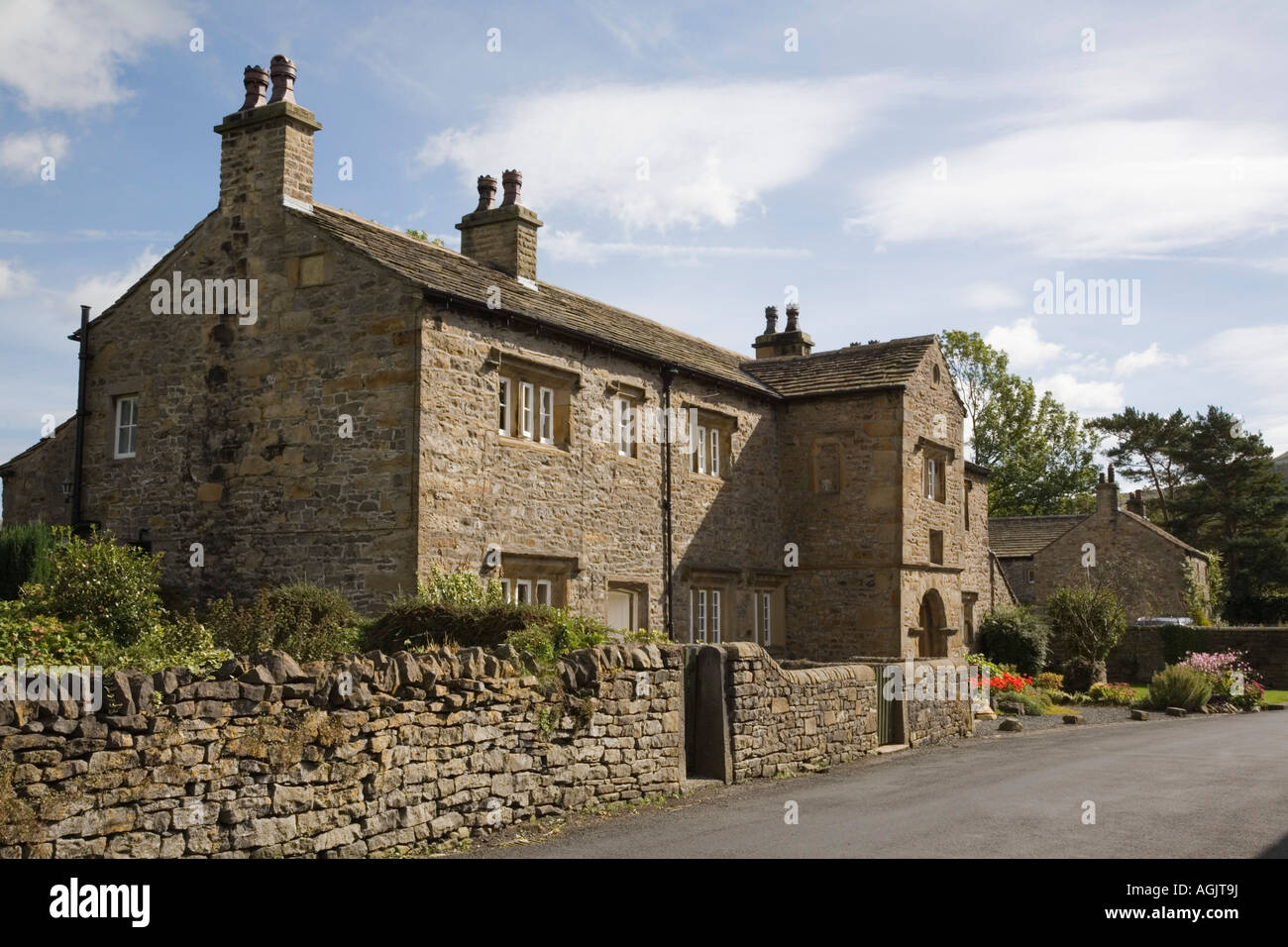 Old stone house and wall in lovely unspoilt picturesque village in ...