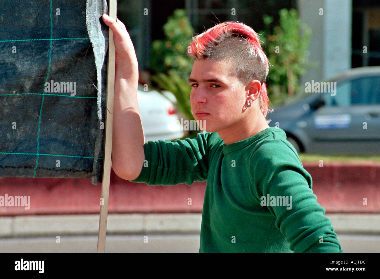 Israel Tel Aviv A punk male with pink hair and a Mohican hair cut and an  anti police brutality demonstration Stock Photo - Alamy