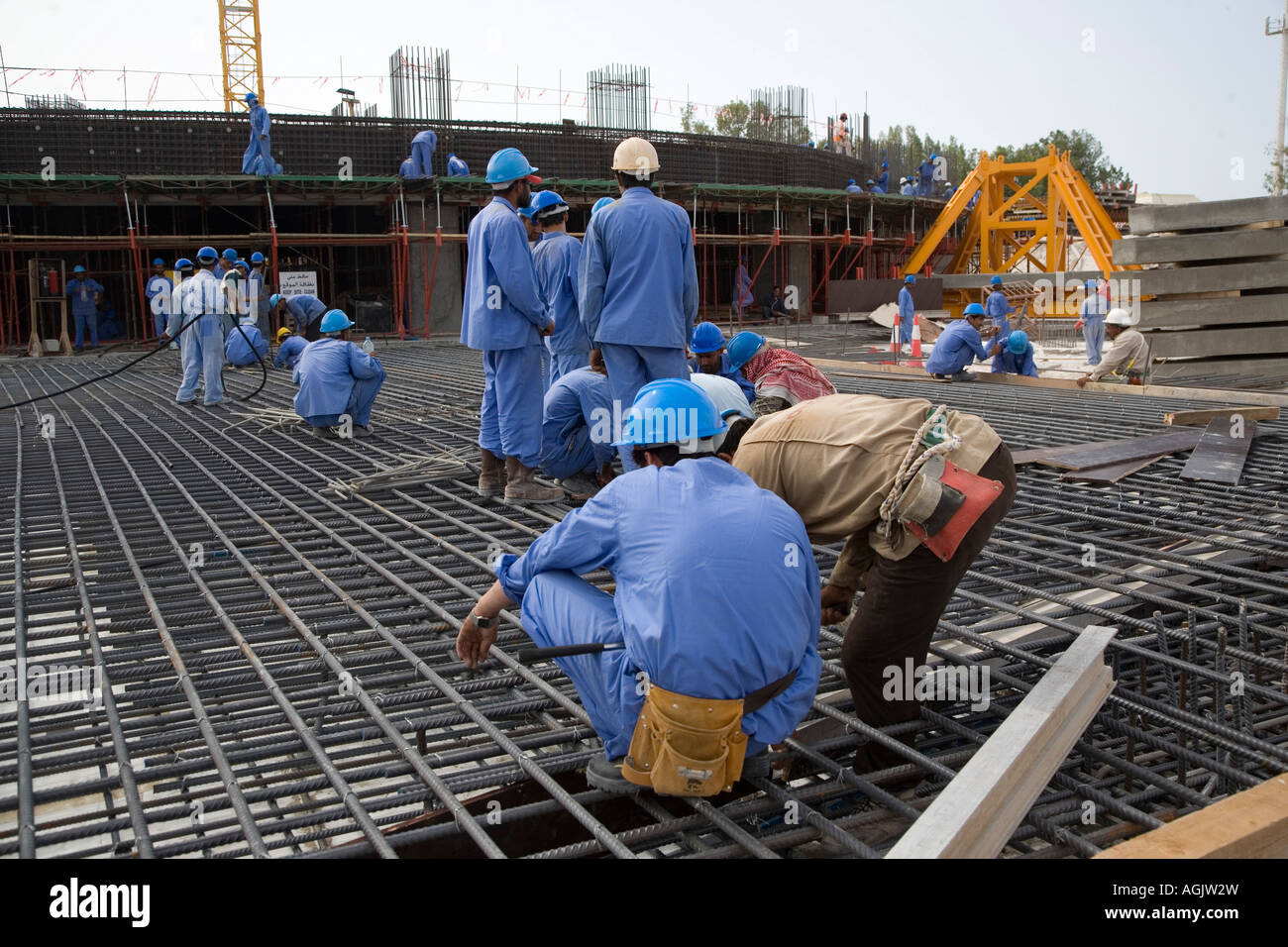Workers working on rebar reinforced concrete foundations floor base on