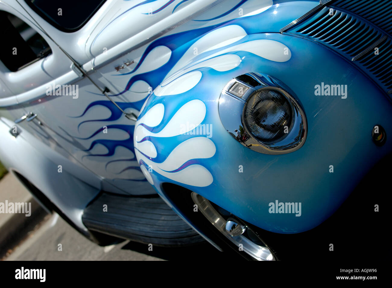 Front side of vintage car white with blue flames paint job Stock Photo