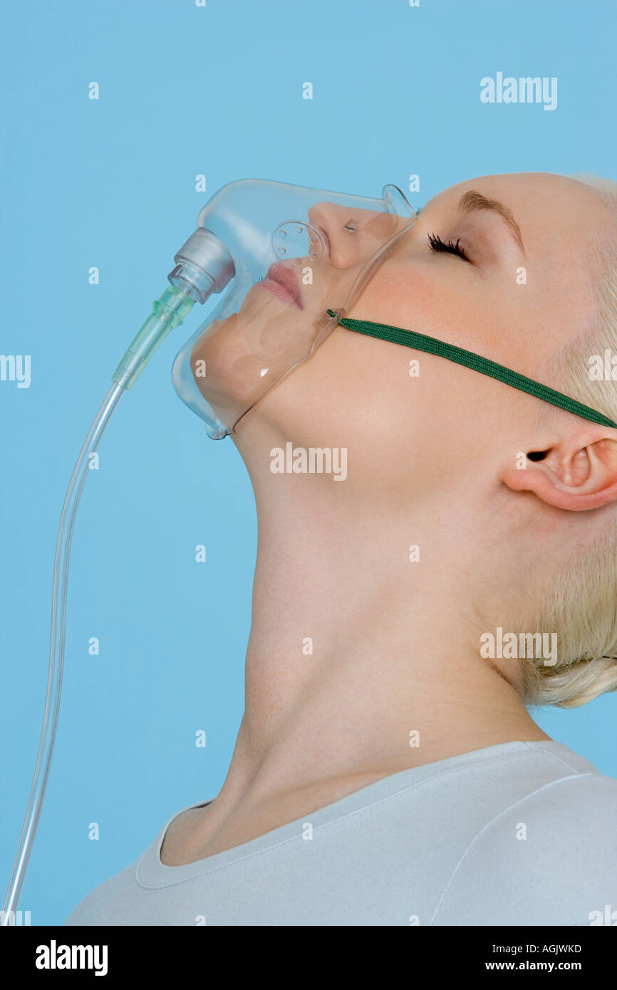 Young woman wearing oxygen mask hi-res stock photography and images - Alamy