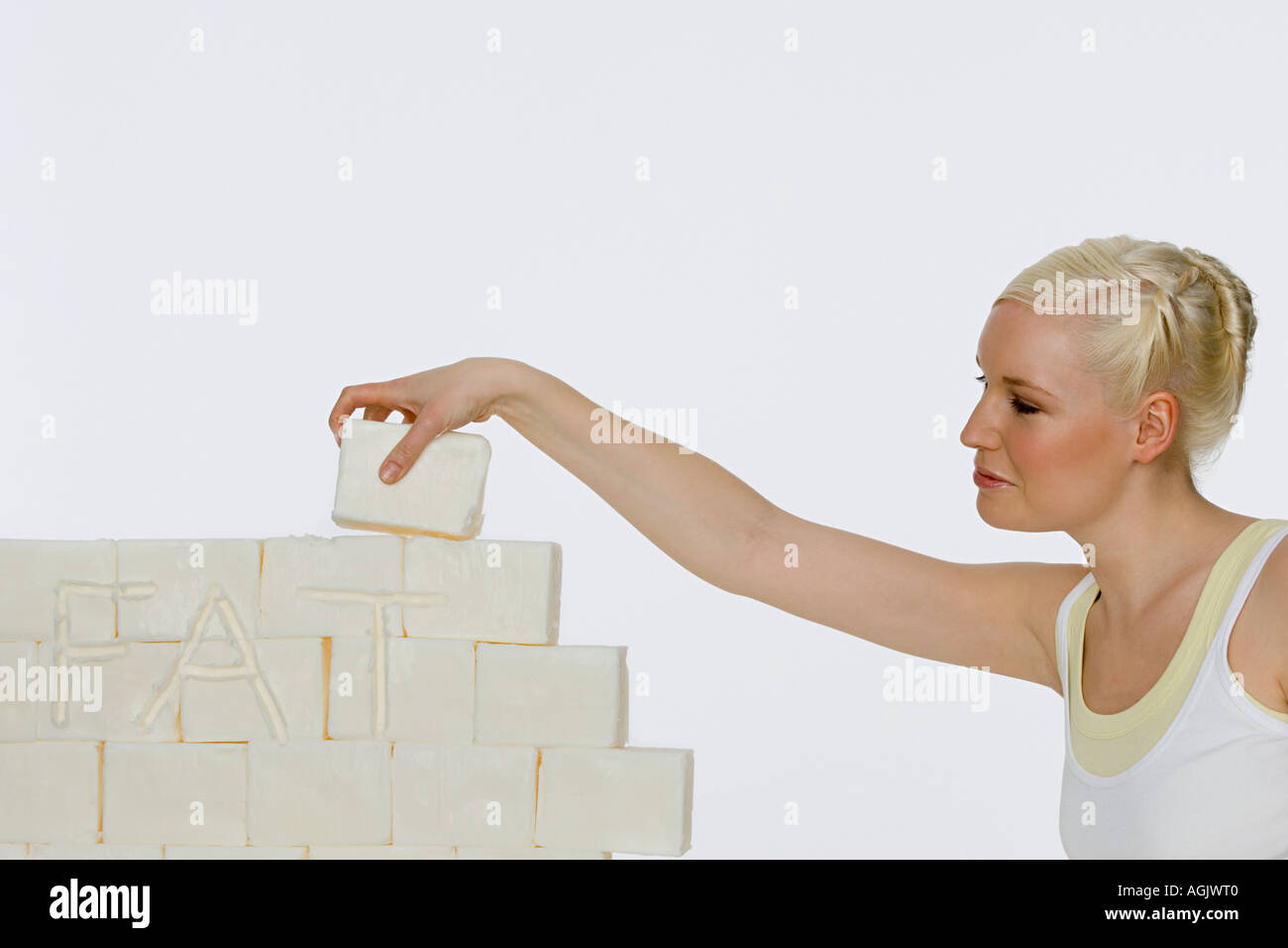 Young woman holding a block of lard Stock Photo Alamy