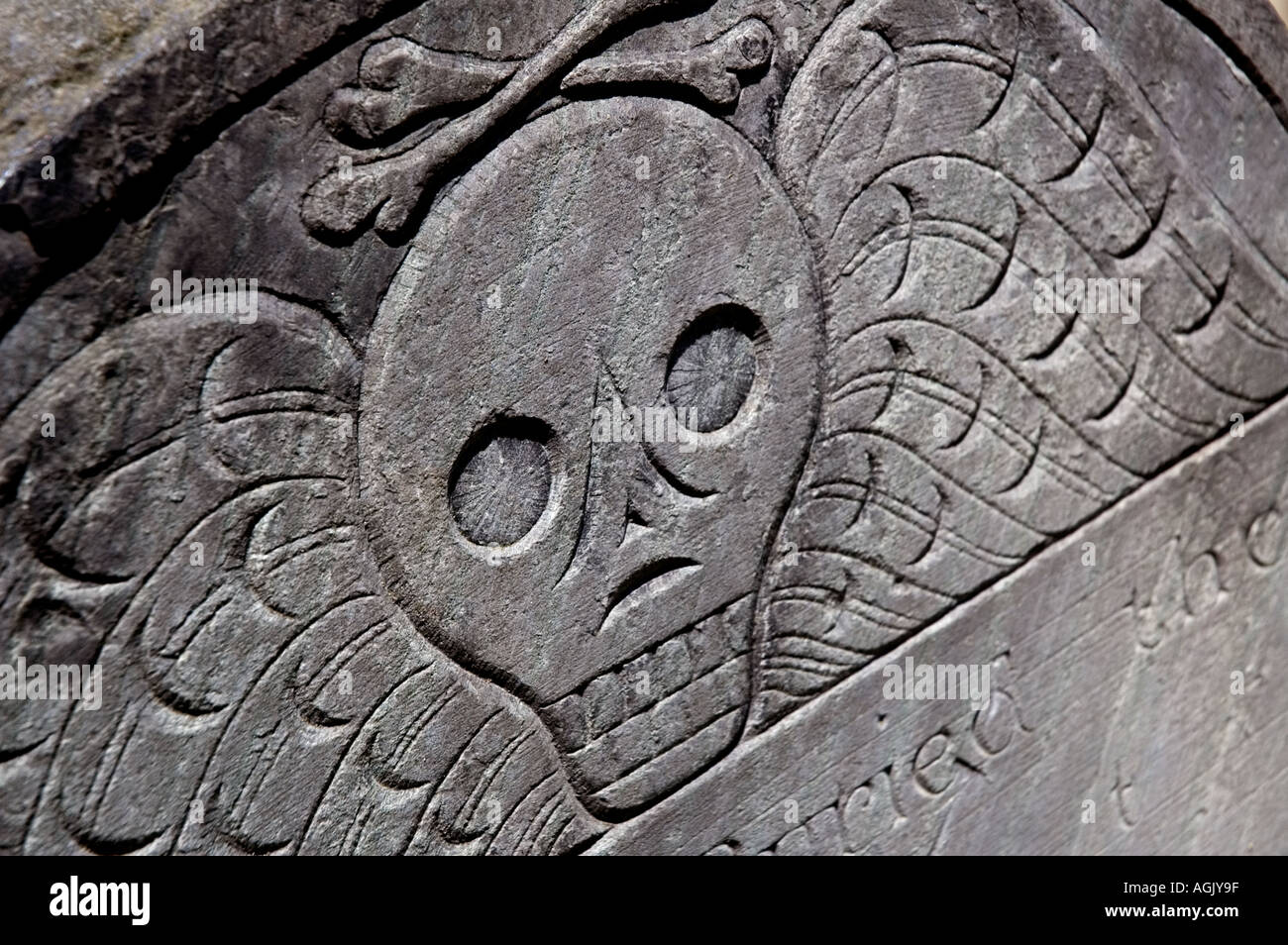 Detail of winged skull on old tombstone in Boston cemetery
