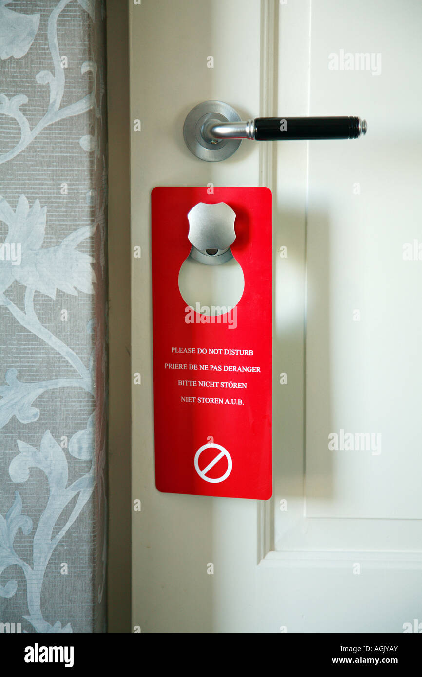 PLEASE DO NOT DISTURB sign hanging on a hotel door Stock Photo