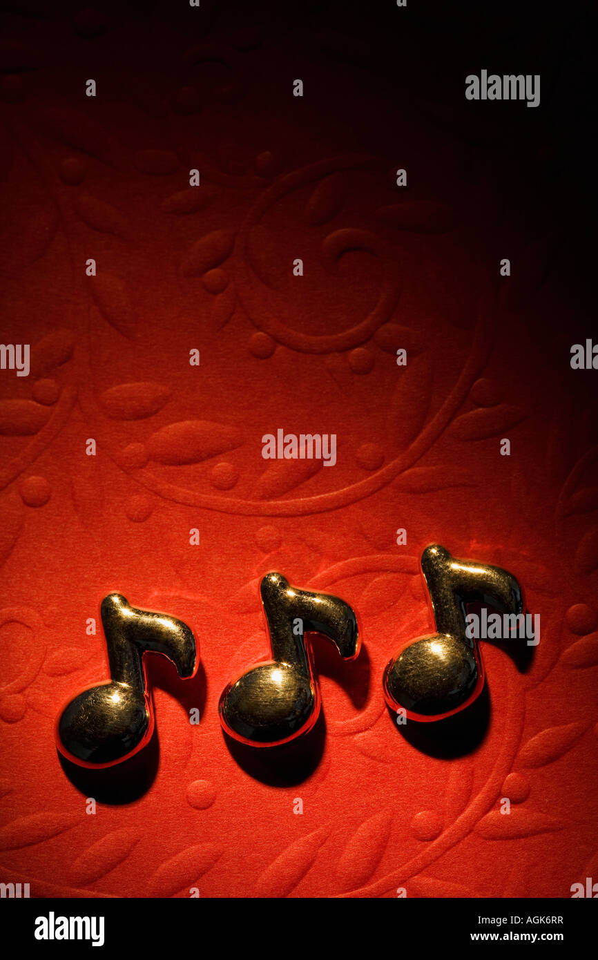 Musical notes on the red background Stock Photo