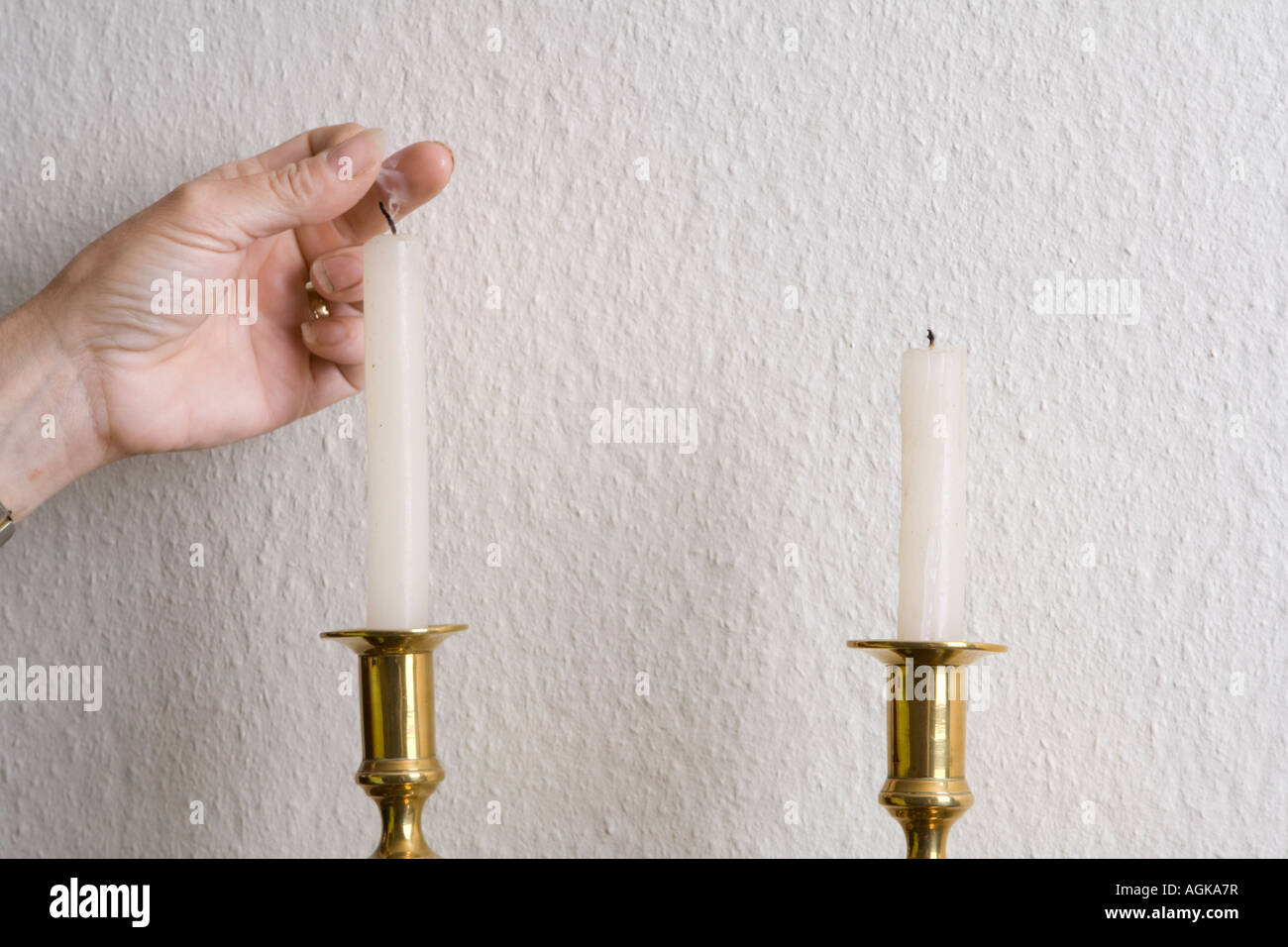 Hand snuffing out a candle hires stock photography and images Alamy