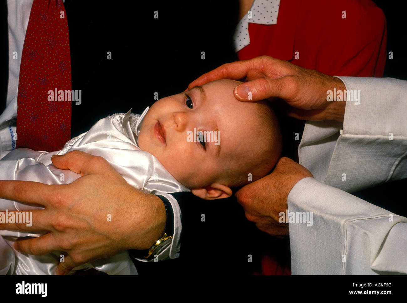 Roman Catholic priest, baptism, christening, baptizing baby, baby, baptizing boy, boy, church service, religious service, Novato, California Stock Photo