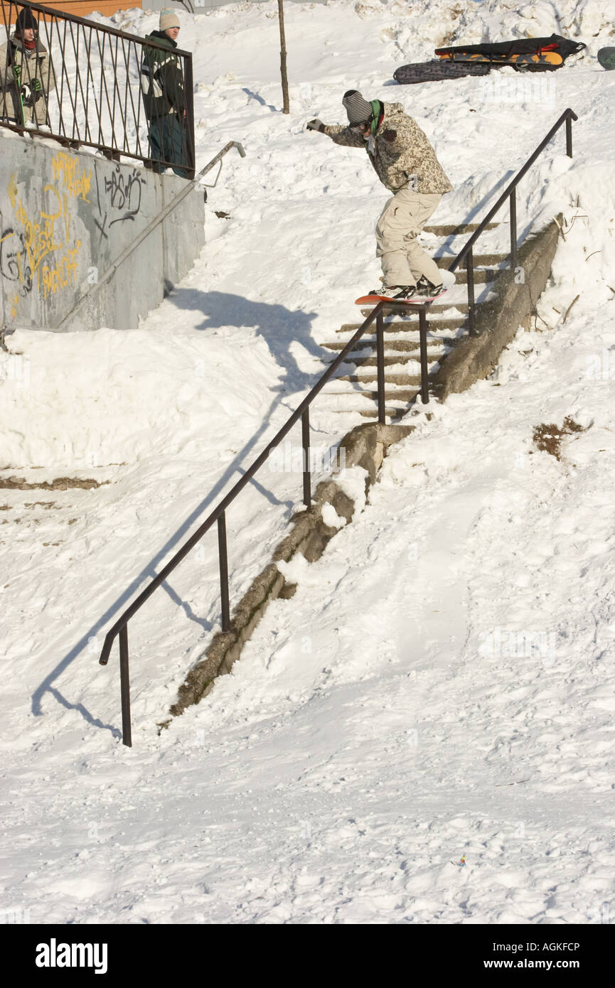 Jibbing snowboard in the city 5 Stock Photo Alamy
