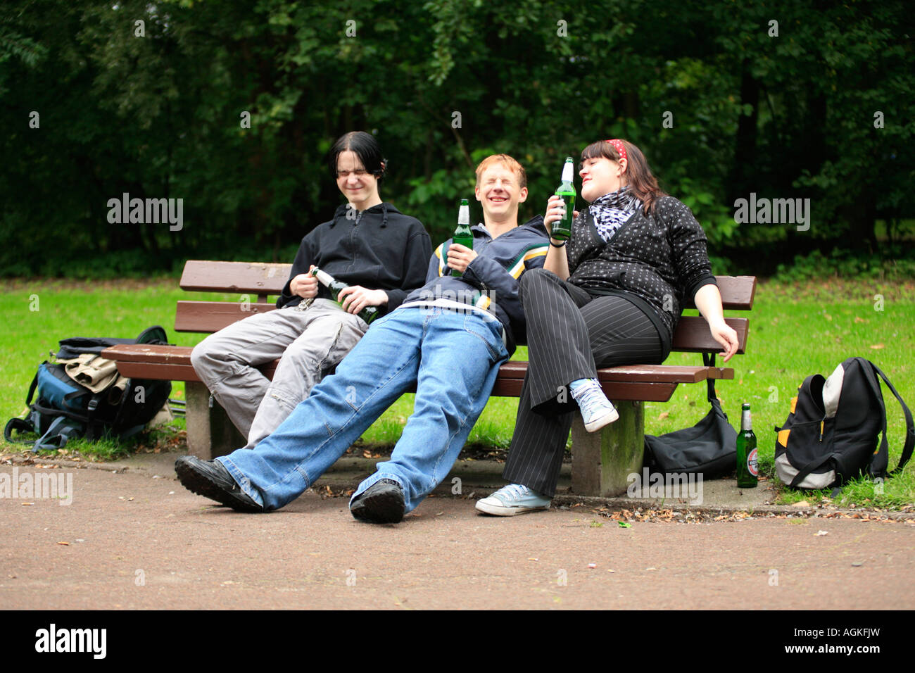 three teenagers drinking beer at a park Stock Photo 14233296 Alamy