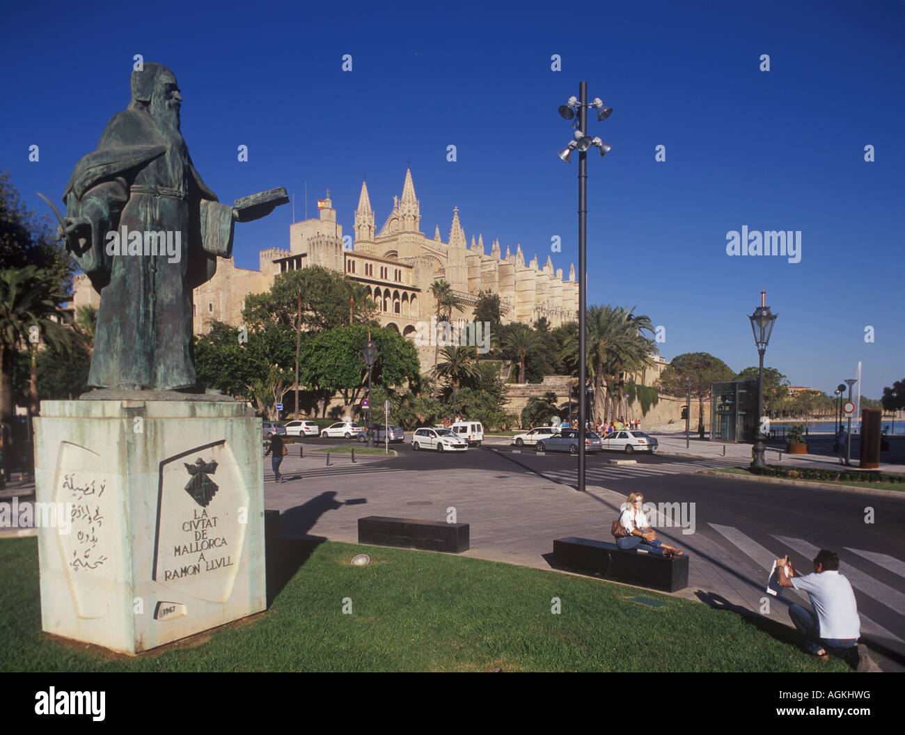 Monument to Ramon Llull, famous  scholar of Palma with Almudaina Royal Palace and historic Gothic Cathedral, Palma de Mallorca. Stock Photo