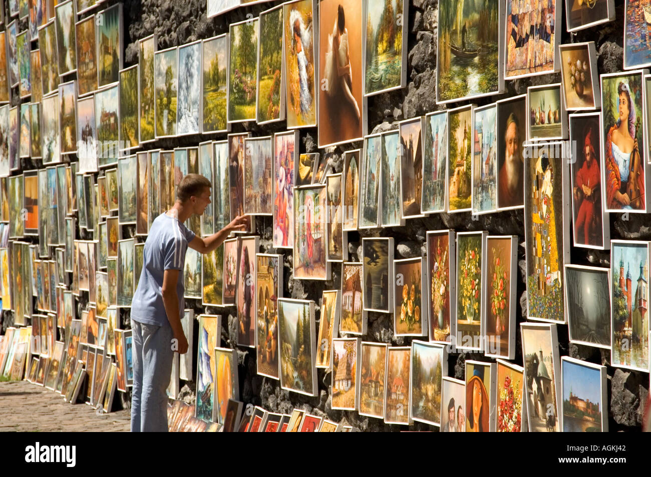Paintings for sale by local artists on the old medieval city walls of