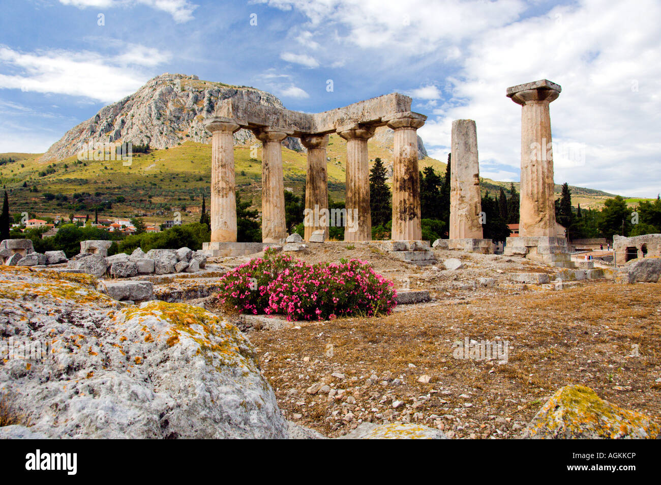 Ruins of the ancient city of Corinth with the Acropolis of Acrocorinth ...