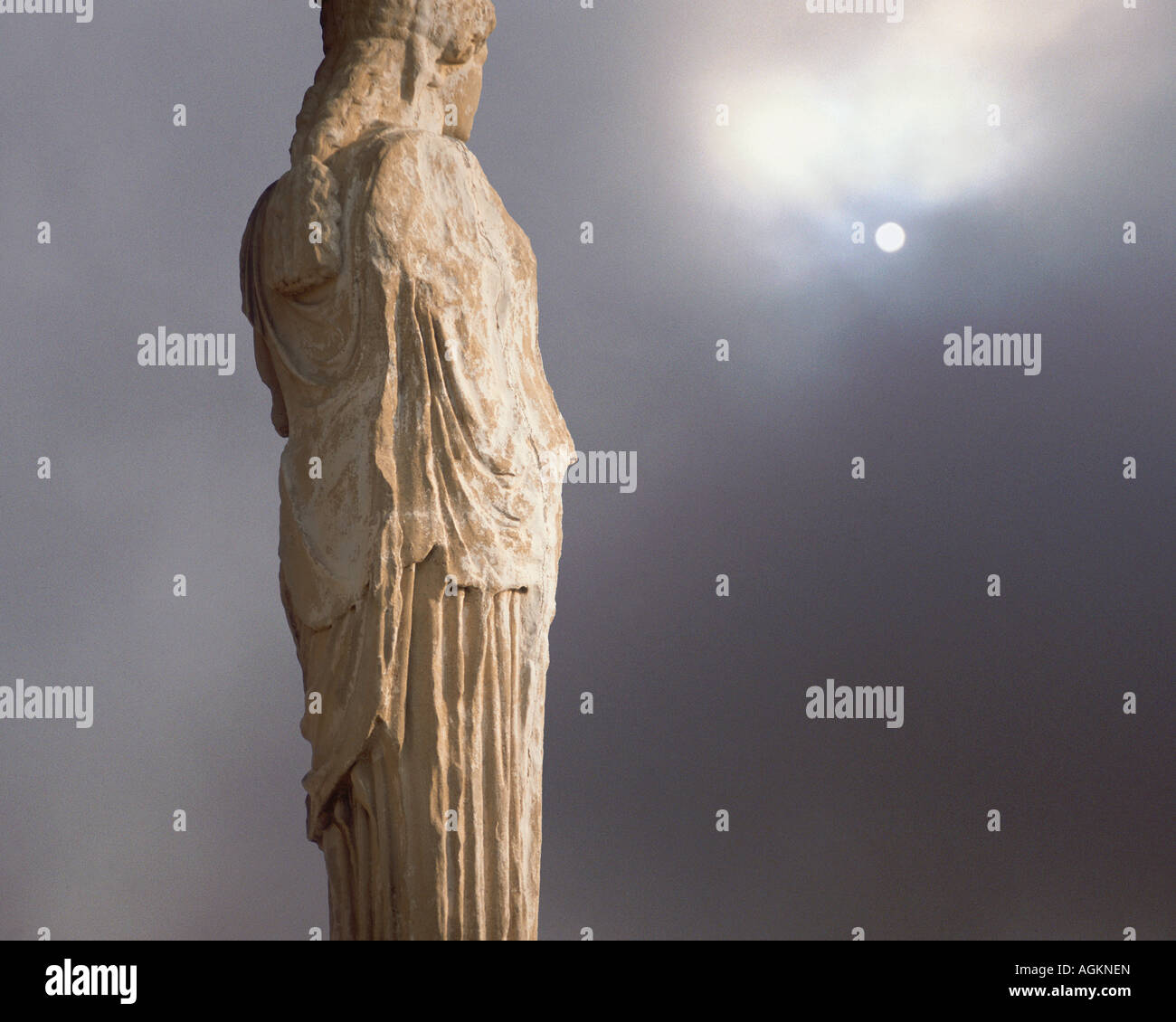 Europe, Greece, Athens. A caryatid from the classical era stands adjacent to the Parthenon at the Acropolis. (digital composite) Stock Photo