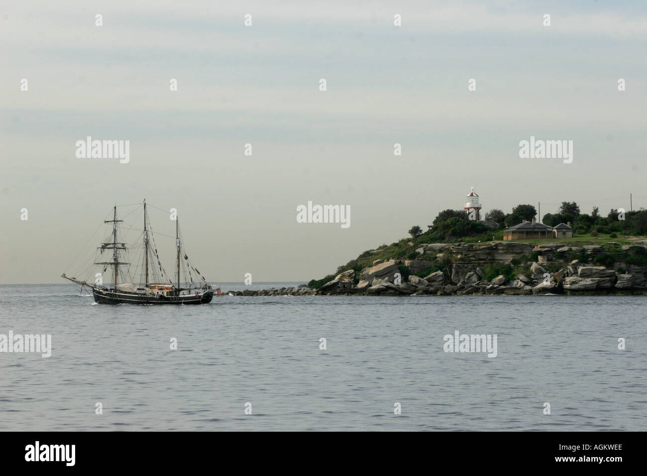 The South head of Sydney harbor with square rigged sailing ship Stock Photo